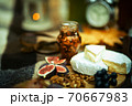 Close-up detail of figs, grapes,cheese, walnuts 70667983