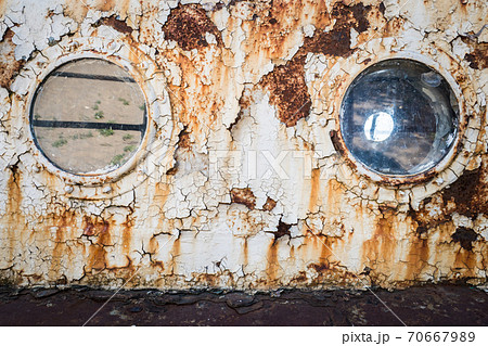 An old abandoned ship's porthole An old abandoned ship's porthole 70667989