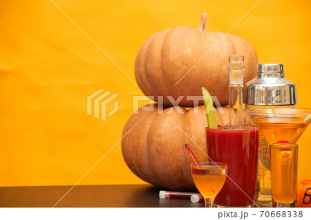 halloween bar cocktails party on orange background copy space 70668338