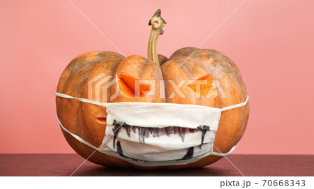 halloween pumpkins with medical mask on pink background copy space halloween pumpkins with medical mask on pink background copy space 70668343