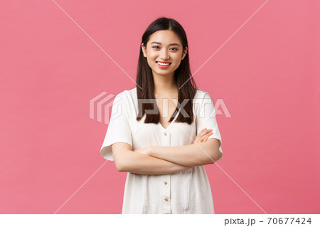 Beauty, people emotions and summer leisure concept. Cheerful silly asian girl in white dress, cross arms chest, smiling happy at camera, standing pink background enthusiastic Beauty, people emotions and summer leisure concept. Cheerful silly asian girl in white dress, cross arms chest, smiling happy at camera, standing pink background enthusiastic 70677424