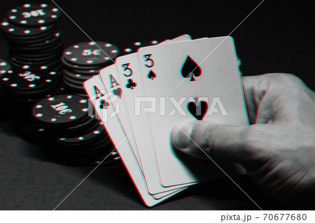 cards with two pairs in poker in the hands of a gambler on the background of gaming chips cards with two pairs in poker in the hands of a gambler on the background of gaming chips 70677680