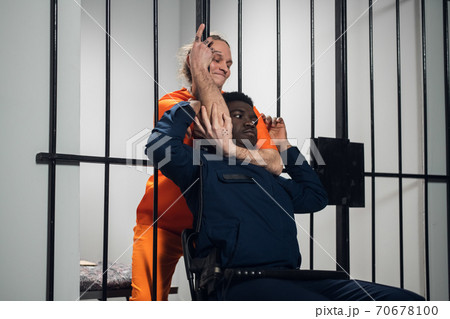 A wild homicidal maniac sentenced to life in prison attacks the warden and strangles him. A wild homicidal maniac sentenced to life in prison attacks the warden and strangles him. 70678100