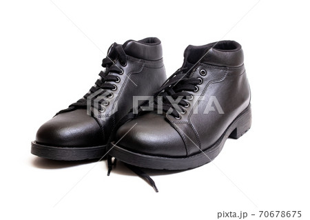 Black leather mens boots isolated on white background Black leather mens boots isolated on white background 70678675