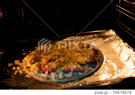 Pizza with cheese in the oven closeup 70678678