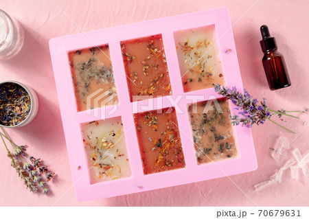 Handmade soap, the process of making. Glycerin with herbs, poured into a special mold for drying, shot from the top 70679631