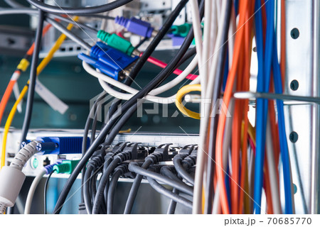 Detail of server room with bunch of fiber optic cables and ether 70685770
