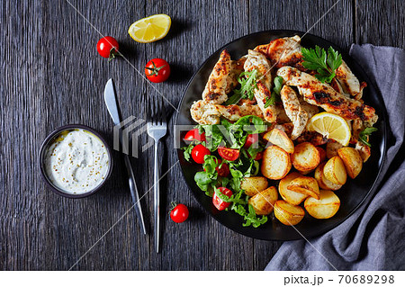 Mediterranean chicken strips with salad, top view 70689298