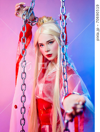 a woman in a geisha costume chained in large chains a woman in a geisha costume chained in large chains 70690519
