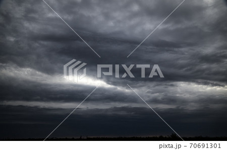 beautiful dark dramatic sky with stormy clouds 70691301