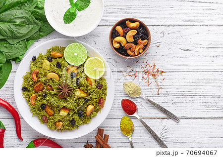 Palak Paneer Biryani and Raita at white background with. Vegetarian indian cuisine dish 70694067