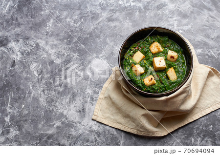 Palak Paneer at grey concrete background 70694094
