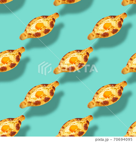 Flying Khachapuri Adjarian seamless food pattern on mint green backdrop. Georgian cuisine texture 70694095
