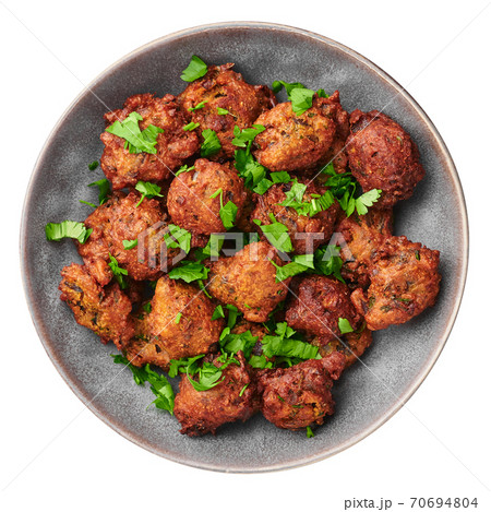 Veg Pakora in gray bowl isolated on white. Pakoda is indian cuisine deep fried dish. Asian food 70694804