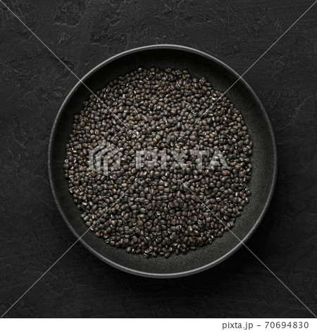 Black Gram or Urad Beans or Mung Beans in bowl on dark slate table top. Indian cuisine food Black Gram or Urad Beans or Mung Beans in bowl on dark slate table top. Indian cuisine food 70694830