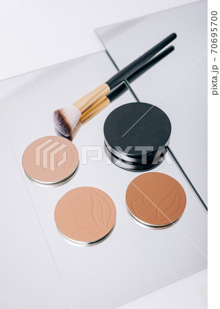 Eye shadow with makeup brushes close up Eye shadow with makeup brushes close up 70695700