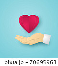Red Heart on Human hand on blue background. Vector illustration. 70695963