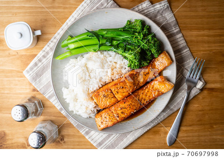 salmon teriyaki with rice and boiled broccolini 70697998