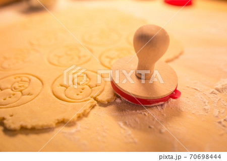 Christmas cookies bakery with raw biscuit dough and cutters with christmas theme shape - Christmas theme dough stamp, Snowman. 70698444