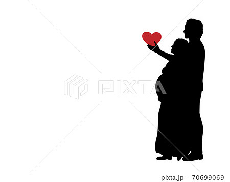 Silhouette loving husband gives heart beloved pregnant wife. 70699069