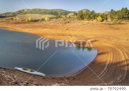 decked expedition canoe on a mountain lake in Colorado decked expedition canoe on a mountain lake in Colorado 70702490