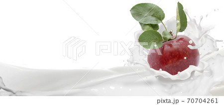 Red apple in a spray of yogurt. Red apple in a spray of yogurt. 70704261