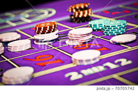 Betting and playing roulette in casino, gambling ad 70705742