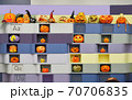 The wall with various halloween carved orange pumpkins crafted by children at the education school. Alphabet letters and funny faces 70706835