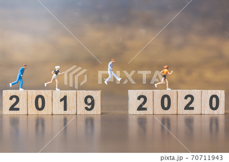Miniature people Jump from number 2019 to 2020 Miniature people Jump from number 2019 to 2020 70711943