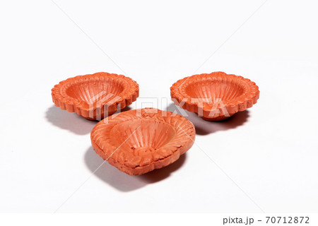 Close up of a beautifully designer handmade clay lamp isolated on white background Close up of a beautifully designer handmade clay lamp isolated on white background 70712872