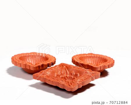 Close up of a beautifully designer handmade clay lamp isolated on white background 70712884