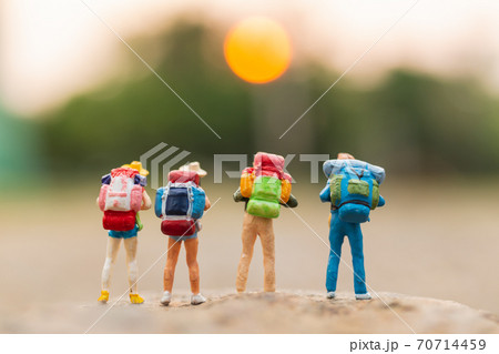 Miniature people : Traveler with backpack walking on the rock  , Travel and Adventure concepts. 70714459