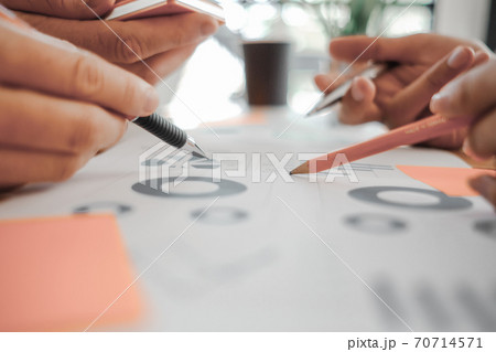 Business people analyzing investment graph meeting brainstorming and discussing plan in meeting room, investment concept 70714571
