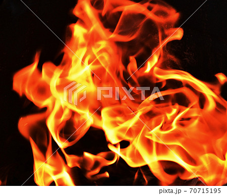 Orange color fire flame on black background	 70715195
