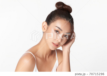 Beautiful young asian woman with clean fresh skin on white background, Face care, Facial treatment, 70715296