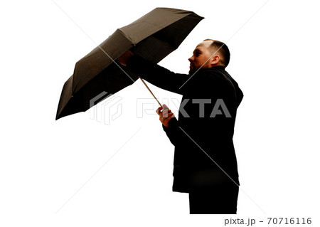 Man with umbrella in studio Man with umbrella in studio 70716116