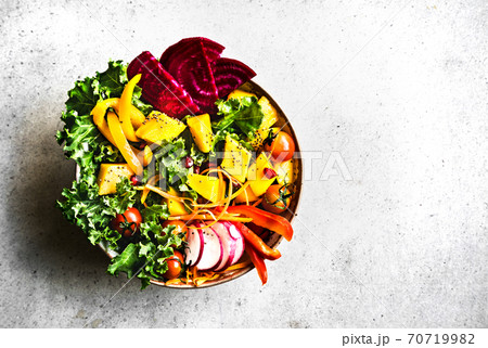 Mango with Kale,Radish and Pomegranate salad 70719982