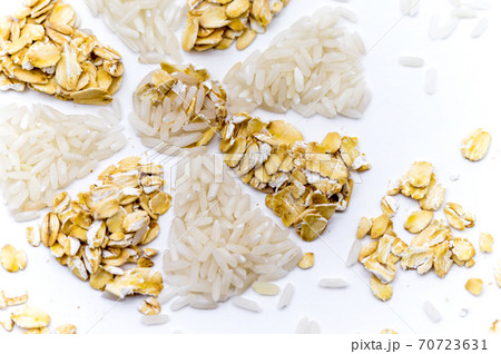 oatmeal and rice on a white background, rice and porridge, snowflake of rice and oatmeal, flower of cereals 70723631