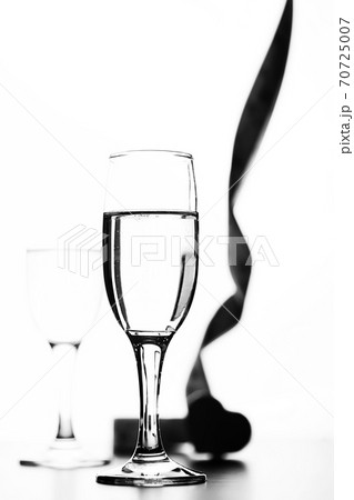 monochrome photo of champagne on white table on white background isolate 70725007