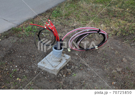 Fiber optic cable lines installation at street 70725850