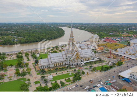 Aerial view of Wat Sothon Wararam or Temple of Dignity, Mueang Cha Choeng Sao District with Chao Phraya River, Cha Choeng Sao urban city downtown skyline, near Bangkok, Thailand. Aerial view of Wat Sothon Wararam or Temple of Dignity, Mueang Cha Choeng Sao District with Chao Phraya River, Cha Choeng Sao urban city downtown skyline, near Bangkok, Thailand. 70726422