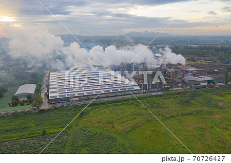 Aerial view of Mae Moh Coal Power Plant with smoke and toxic air from chimney. Factory industry. Electricity tower in energy or pollution environment concept. Lampang City, Thailand 70726427