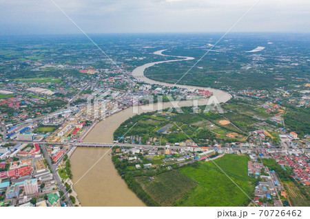 Aerial view of buildings with curve of Chao Phraya River. Cha Choeng Sao skyline near Bangkok, Urban city in downtown area at sunset, Thailand. 70726462