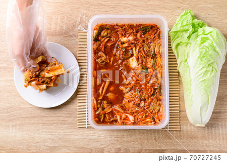 Kimchi cabbage with hand prepare to eating Kimchi cabbage with hand prepare to eating 70727245