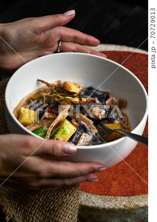 pasta pizzoccheri with chinese cabbage, potato on dark background. italian traditional dish 70729013