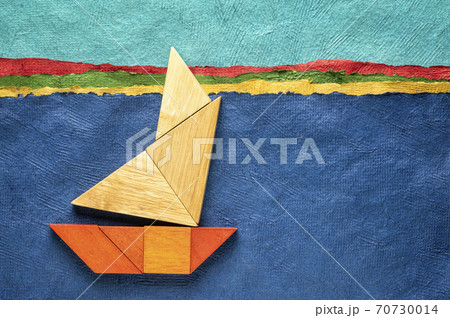 tangram sailboat over abstract paper landscape tangram sailboat over abstract paper landscape 70730014