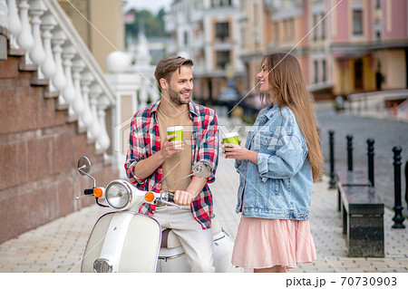 Man and woman drinking morning coffee outdoor Man and woman drinking morning coffee outdoor 70730903