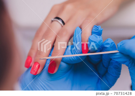 woman doing manicure in a beauty salon. Close-up of hands. woman doing manicure in a beauty salon. Close-up of hands. 70731428