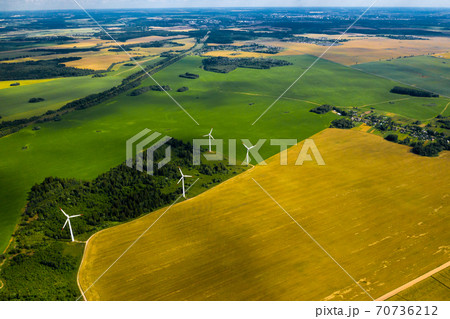Windmills on the background of forests and fields. Windmill in nature.Belarus Windmills on the background of forests and fields. Windmill in nature.Belarus 70736212