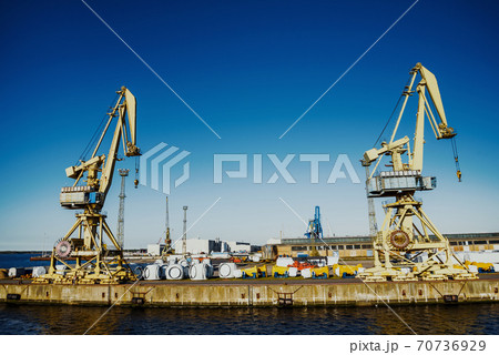 Rostock port full of big cranes, heavy industry. 70736929